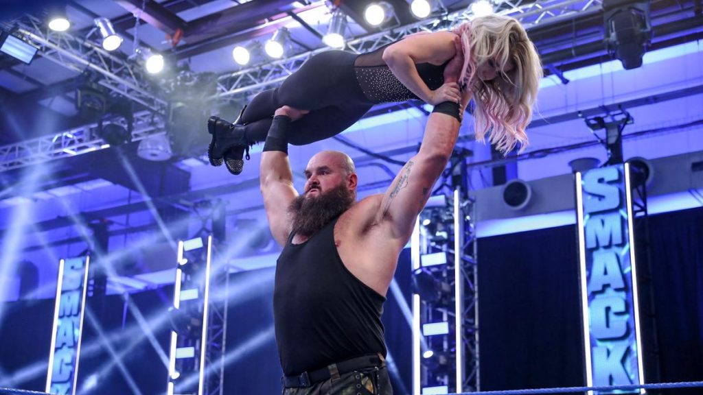 Braun Strowman holds Alexa Bliss over his head