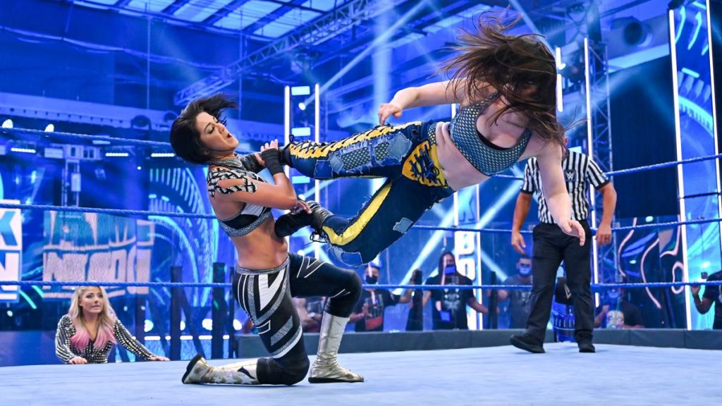 Nikki Cross dropkicks Bayley