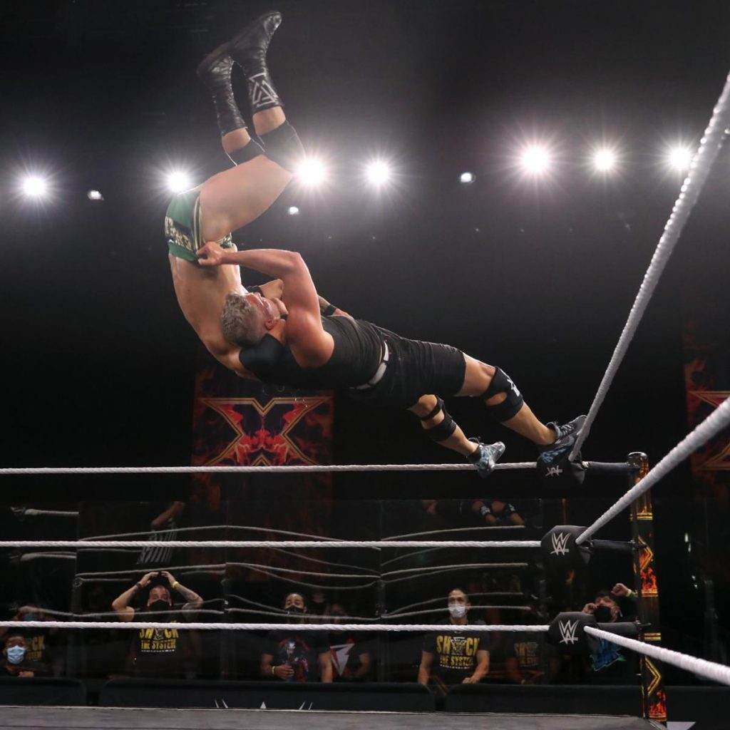 Pat McAfee superplexes Adam Cole from the top turnbuckle