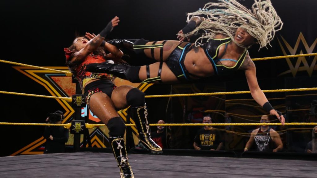 Kayden Carter dropkicks Xia Li