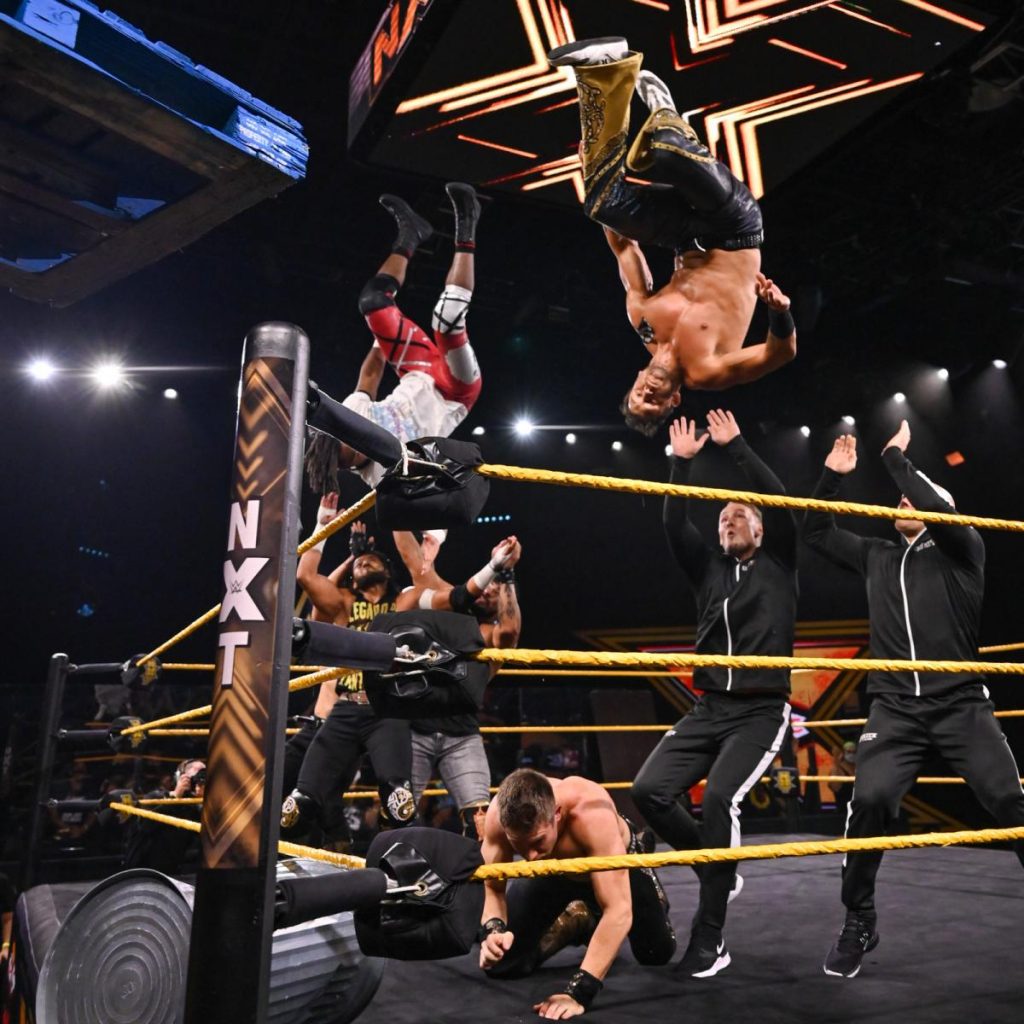 Swerve and Fandango leap off a forklift onto Imperium, Mendoza and Wilde