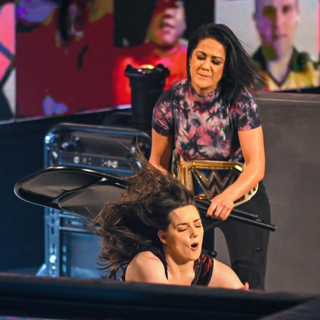Bayley attacks Nikki Cross with a chair