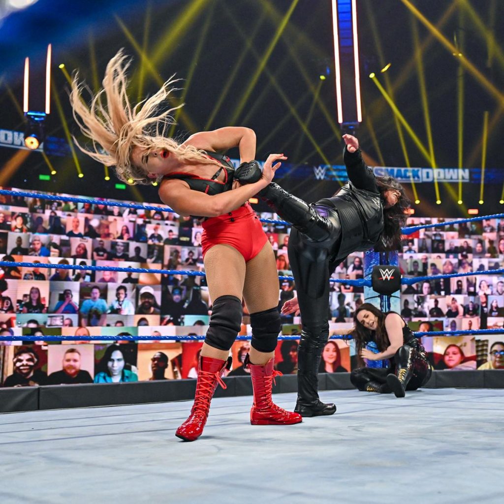 Tamina superkicks Lacey Evans