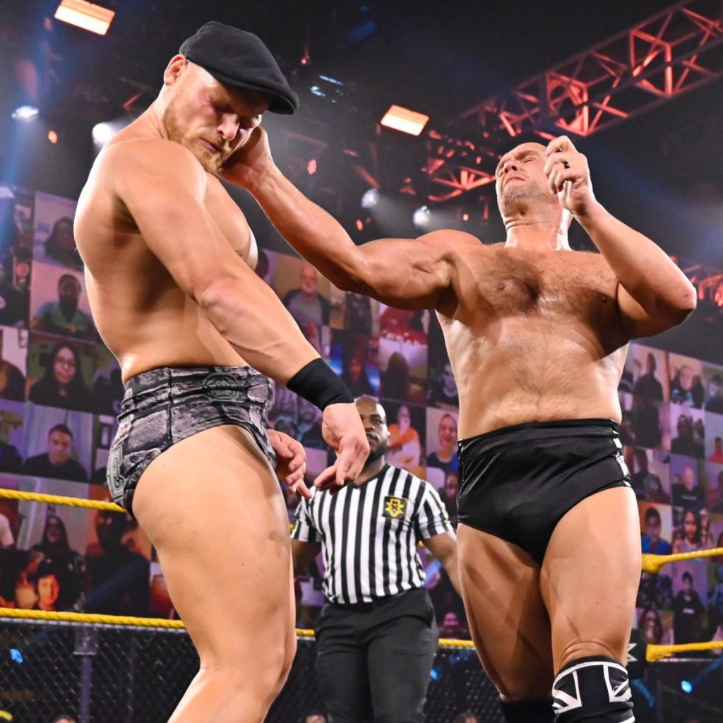 Danny Burch slaps Ridge Holland