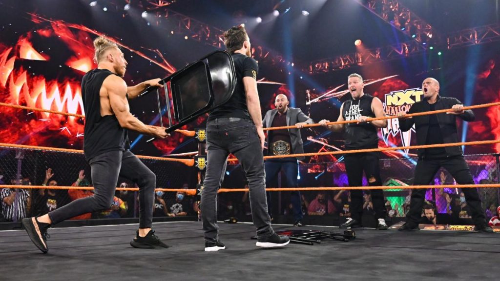 Pete Dunne hits Kyle O'Reilly across the back with a chair and allies himself with Pat McAfee, Danny Burch, and Oney Lorcan