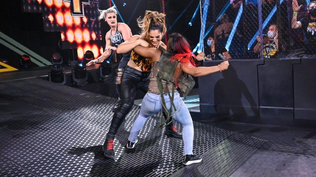 Ember Moon drags Raquel Gonzalez off Rhea Ripley
