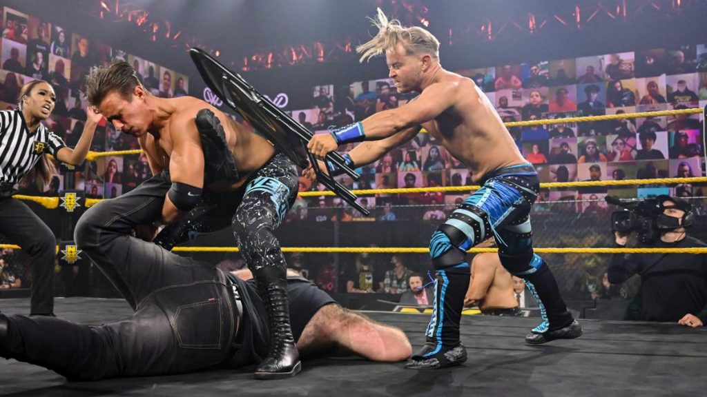 Drake Maverick hits Chase Parker with a chair to get him off Killian Dain
