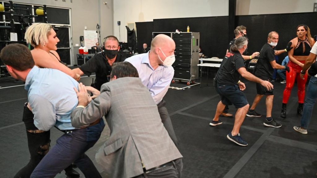 Rhea Ripley and Raquel Gonzalez are held apart by officials