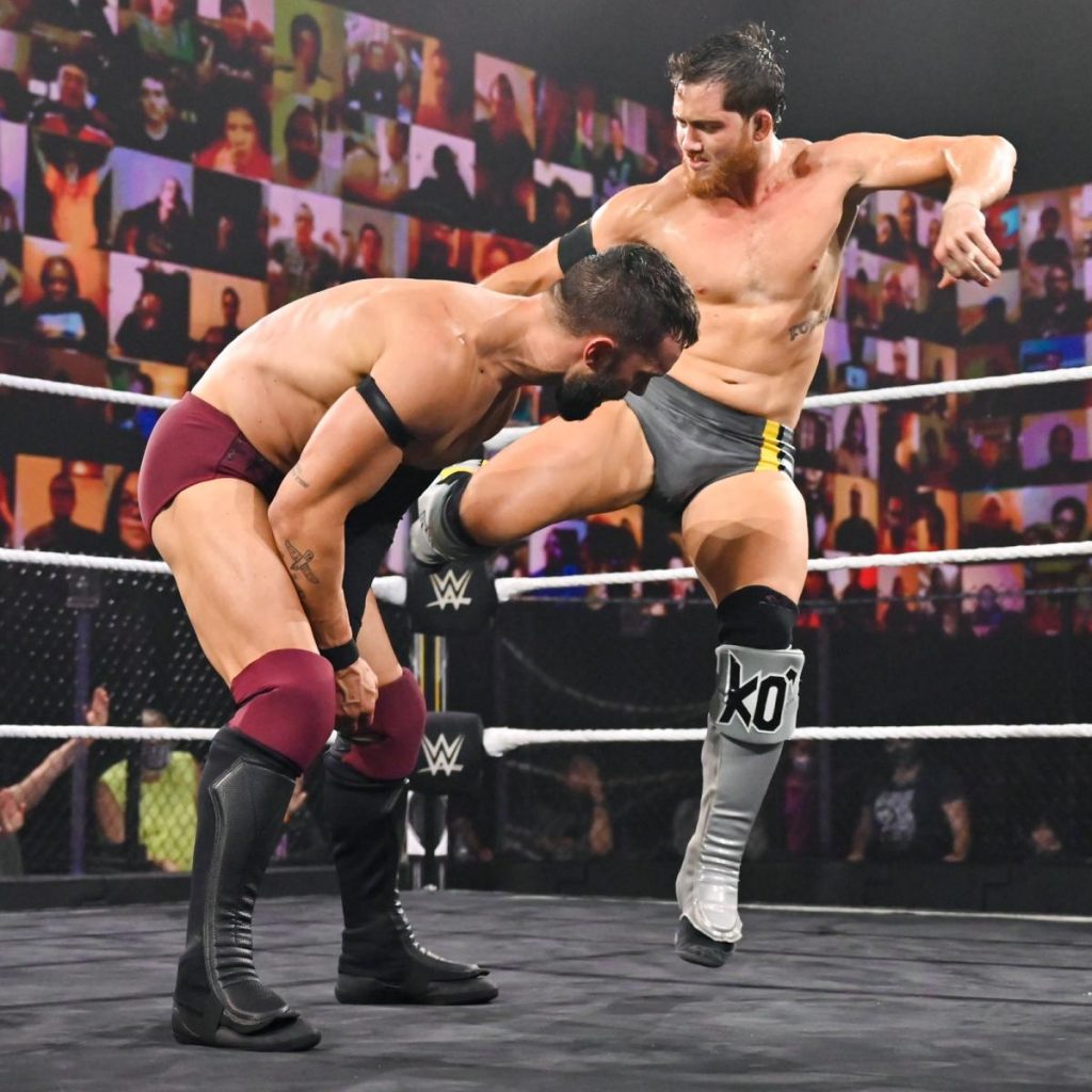 Kyle O'Reilly kicks Finn Balor