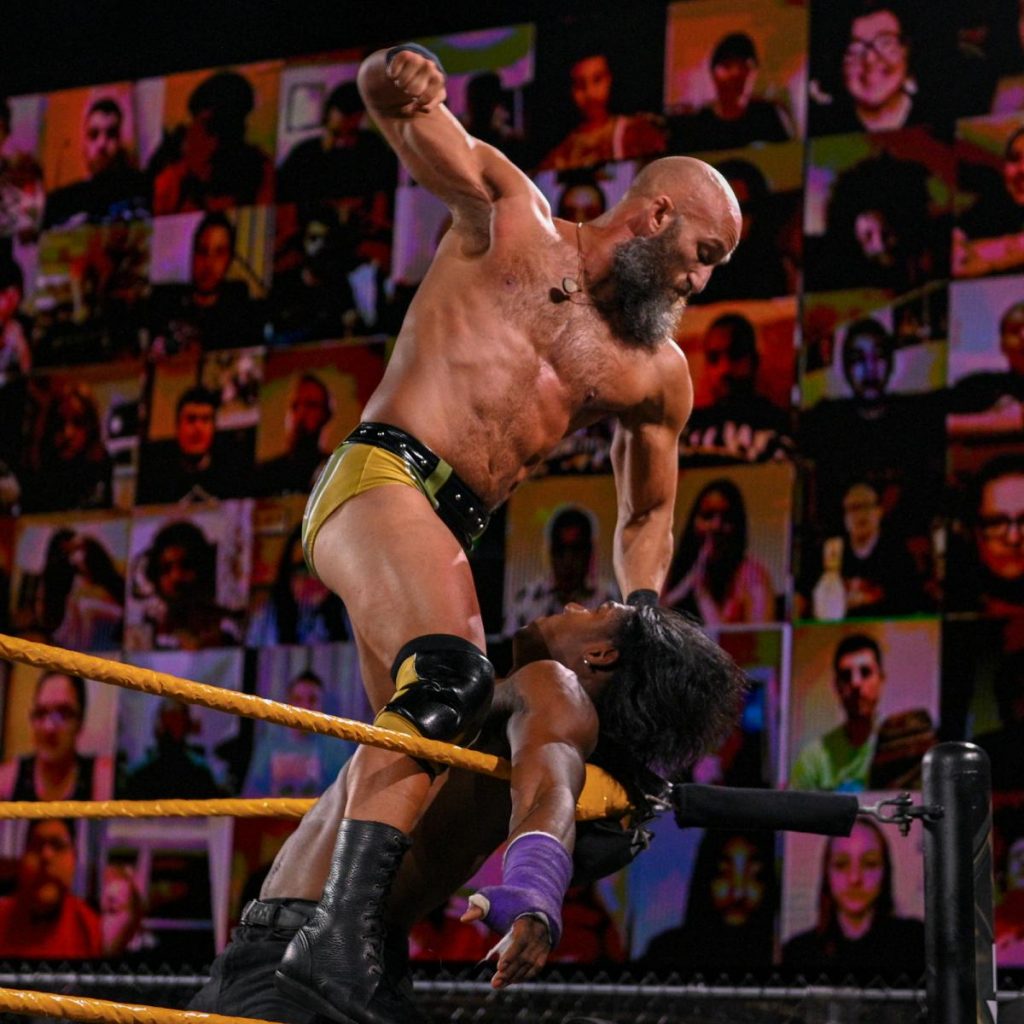 Tommaso Ciampa pounds on Velveteen Dream in the corner