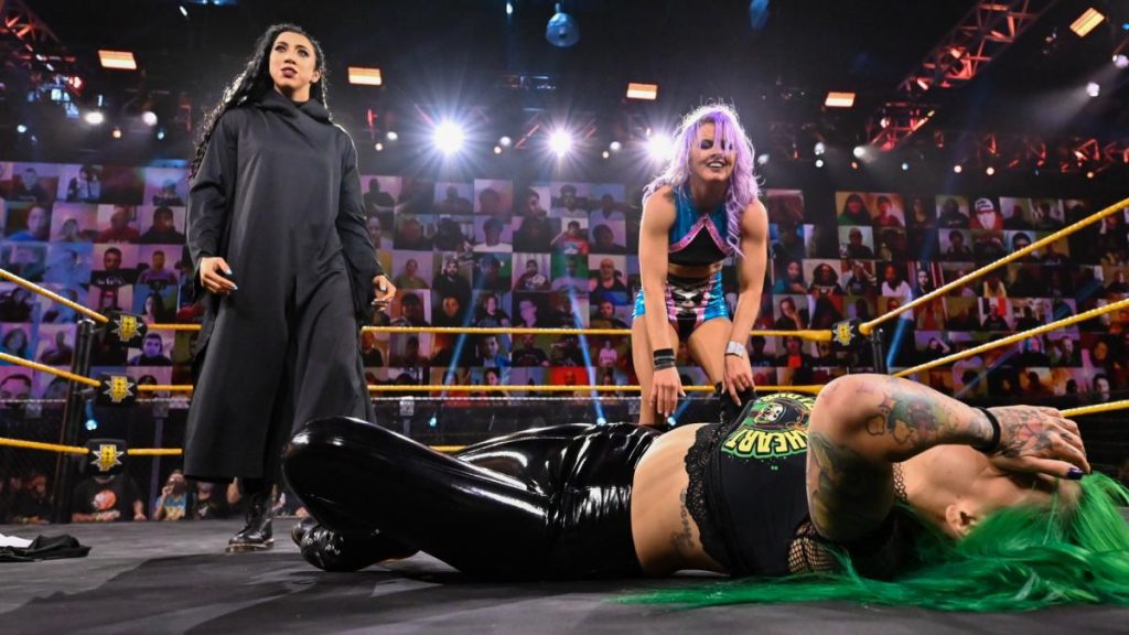 Indi Hartwell and Candice LeRae stand over Shotzi Blackheart