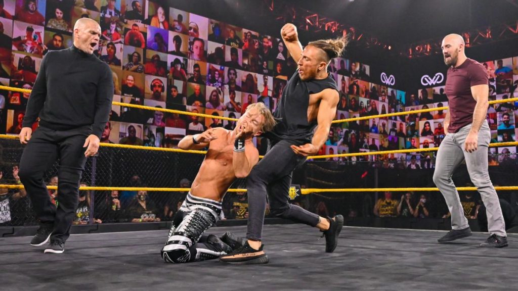 Pete Dunne, Oney Lorcan, and Danny Burch attack Drake Maverick while Pat McAfee records it