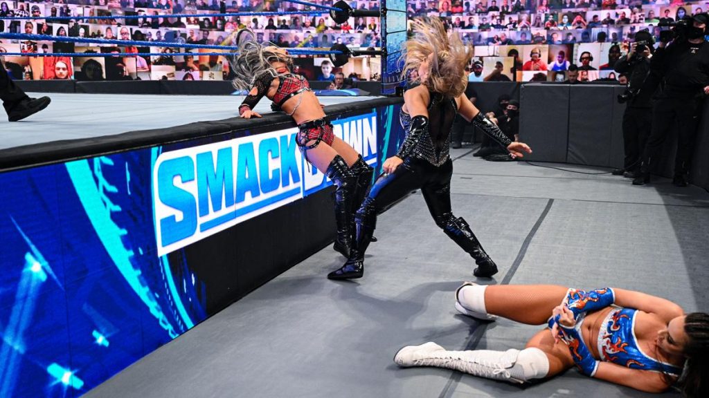 Chelsea Green holding her injured arm