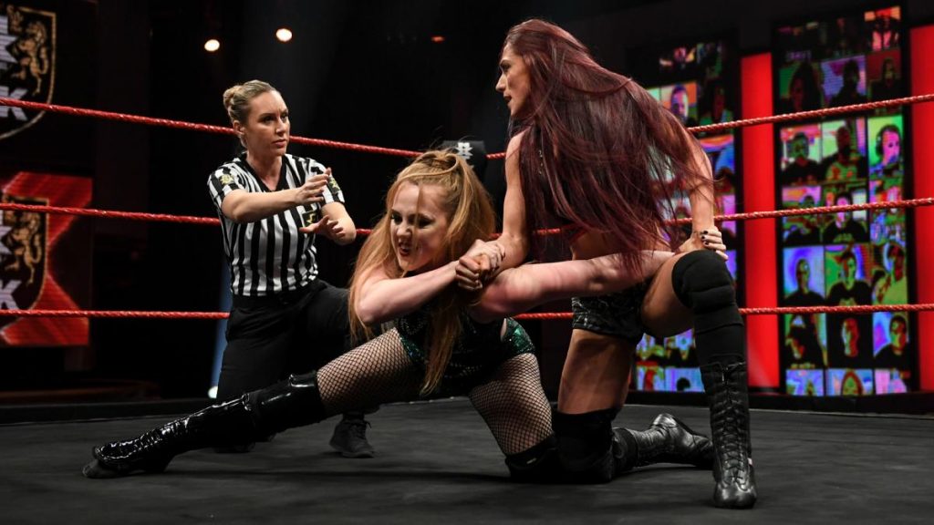 Kay Lee Ray controls Isla Dawn and glares at the ref
