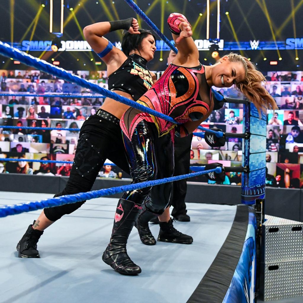 Bayley with Natalya against the ropes