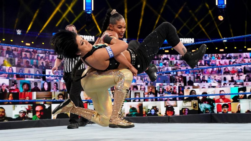 Bianca Belair gives Bayley a backbreaker