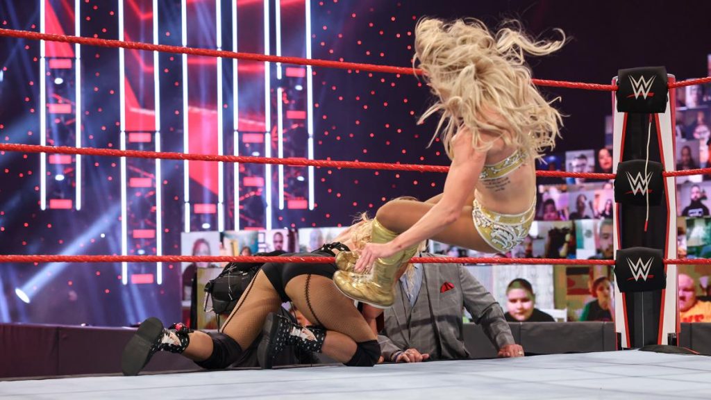 Charlotte Flair dropkicks Lacey Evans