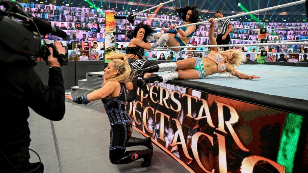 Sareena Sandhu and Charlotte Flair double baseball slide into Natalya and Bayley