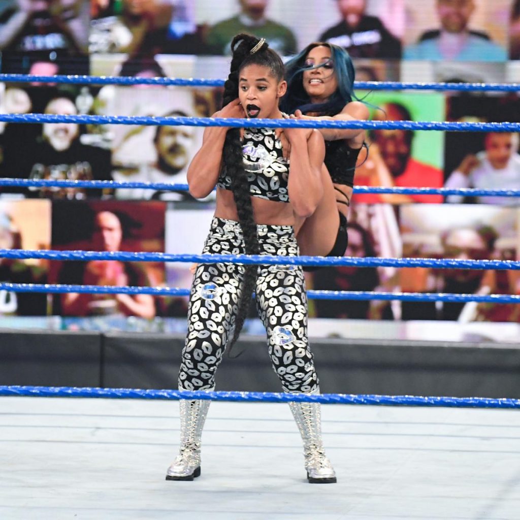 Sasha Banks gives Bianca Belair a backstabber