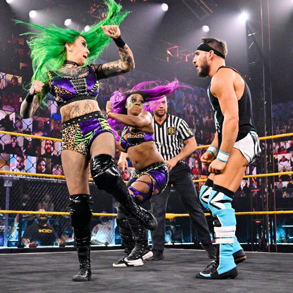 Shotzi Blackheart and Ember Moon kick Johnny Gargano