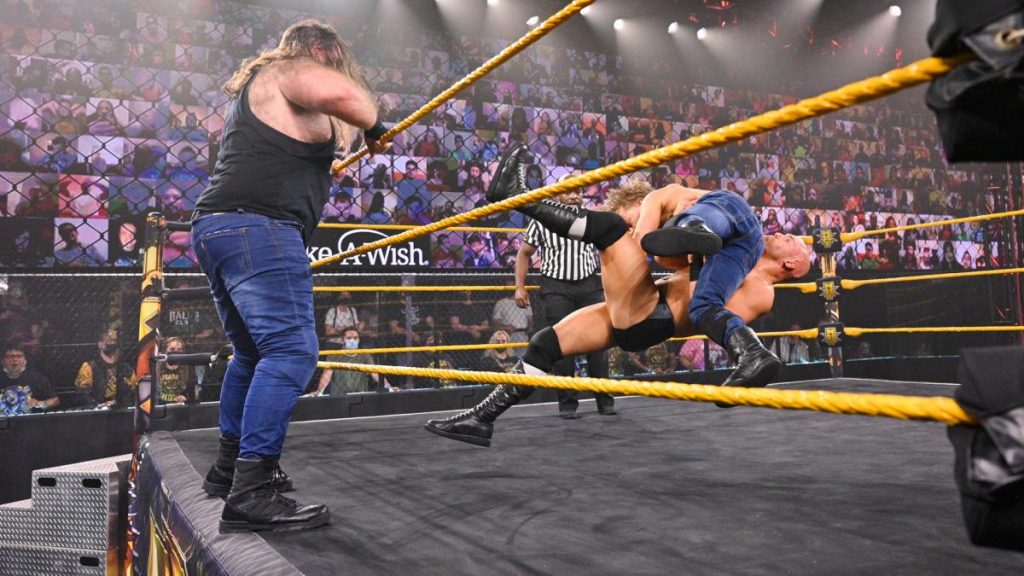 Killian Dain looks at Drake Maverick and Fabian Aichner