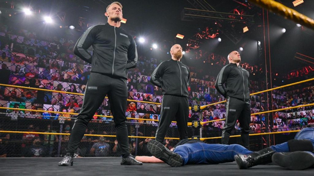 Imperium stand over Drake Maverick and Killian Dain