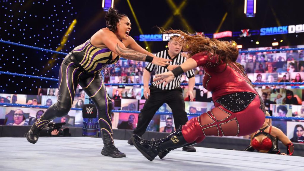 Tamina shoves Nia Jax over