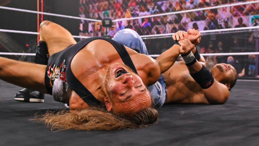 Kushida tries to submit Pete Dunne