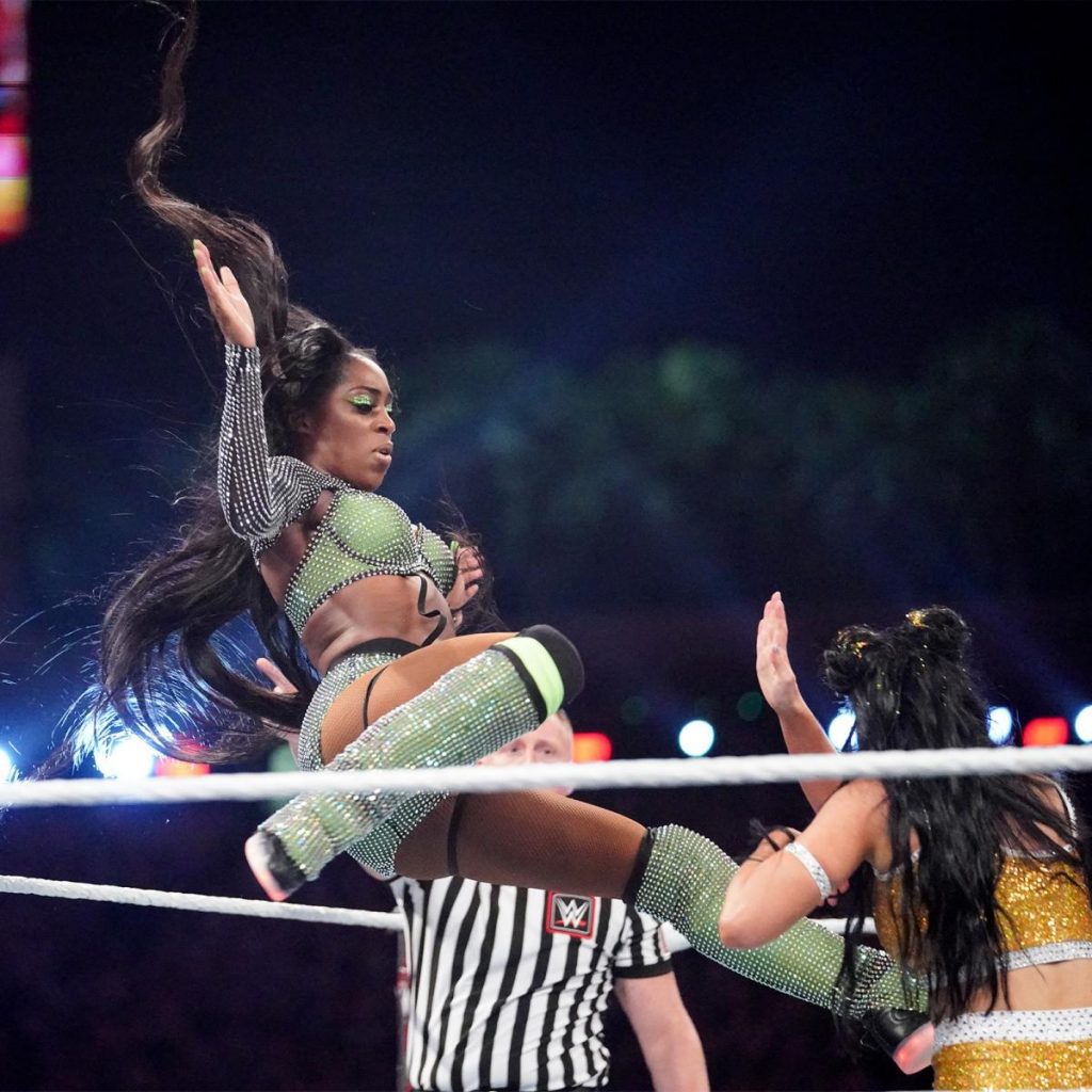 Naomi kicks Billie Kay in the head