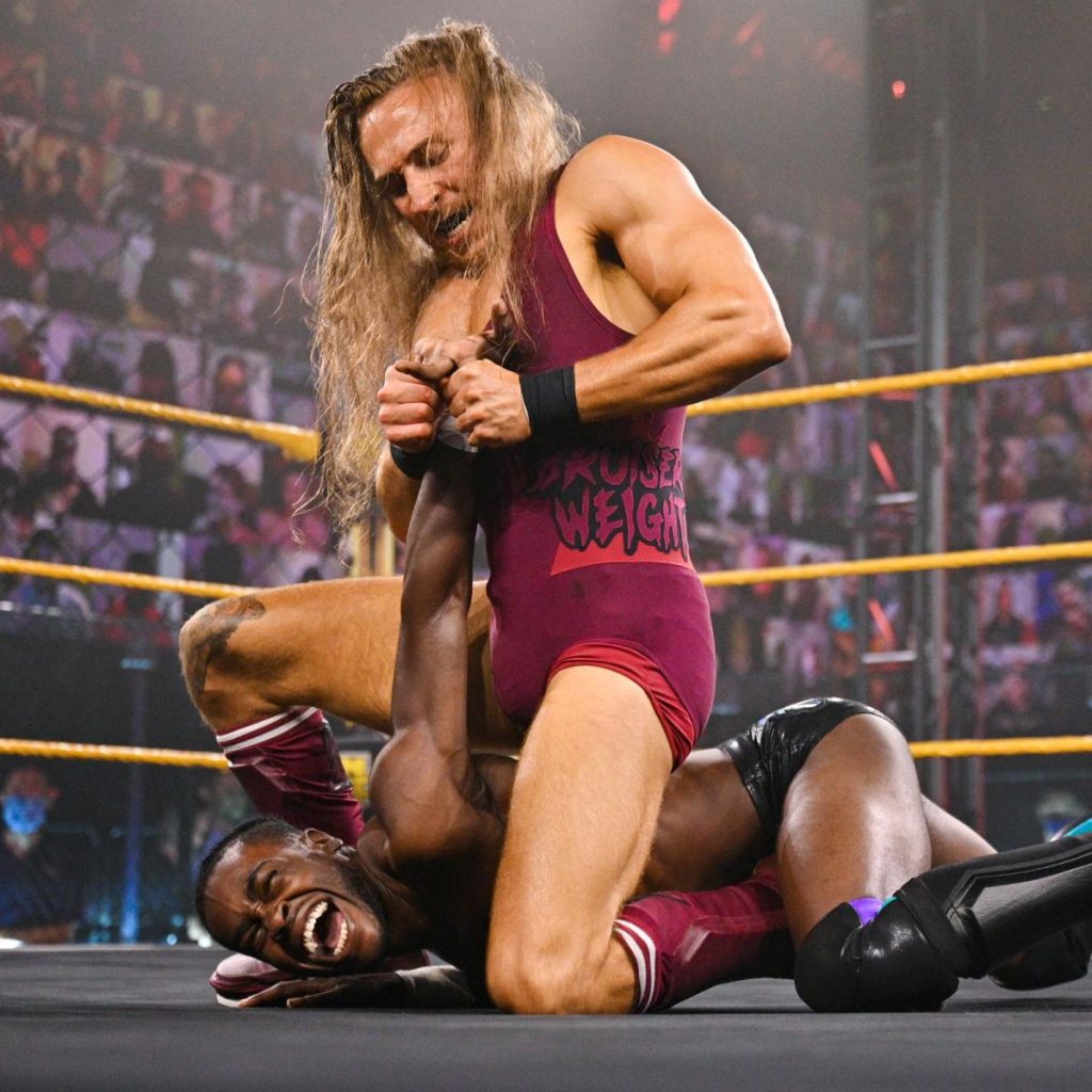 Pete Dunne manipulates Leon Ruff's fingers