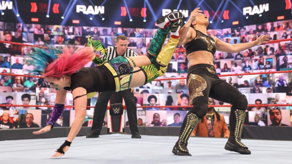 Asuka dropkicks Shayna Baszler