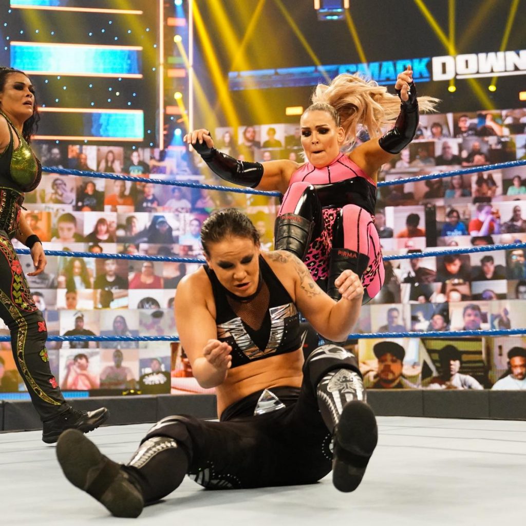 Natalya kicks Shayna Baszler in the back