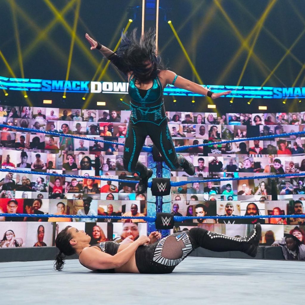 Tamina dives onto Shayna Baszler