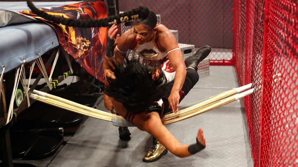 Bayley crashes through kendo sticks courtesy of Bianca Belair