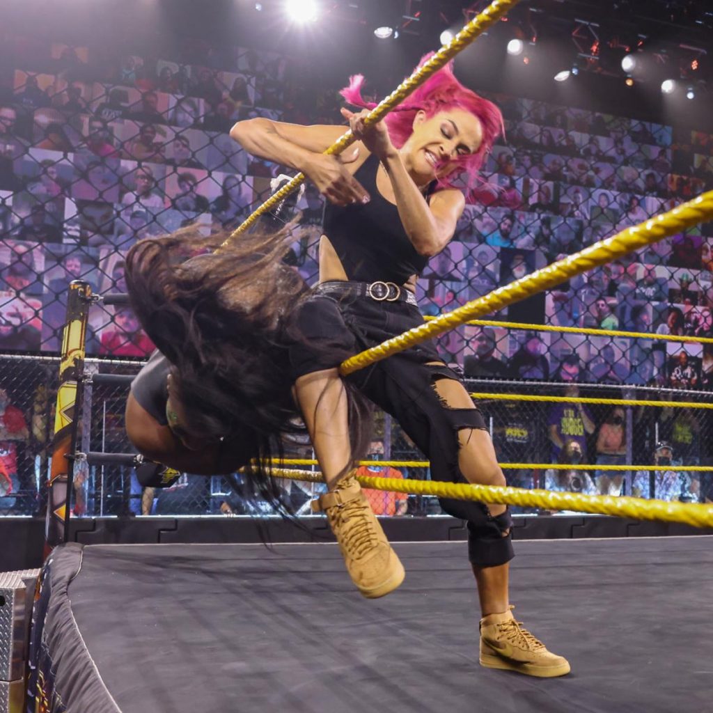 Dakota Kai kicks Ember Moon out of the ring