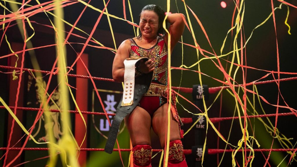 Meiko Satomura cries as she celebrates covered in streamers