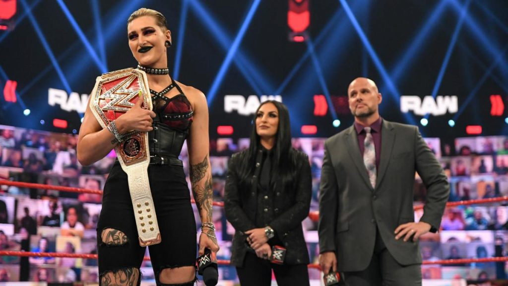 Rhea Ripley, Sonya Deville, and Adam Pearce