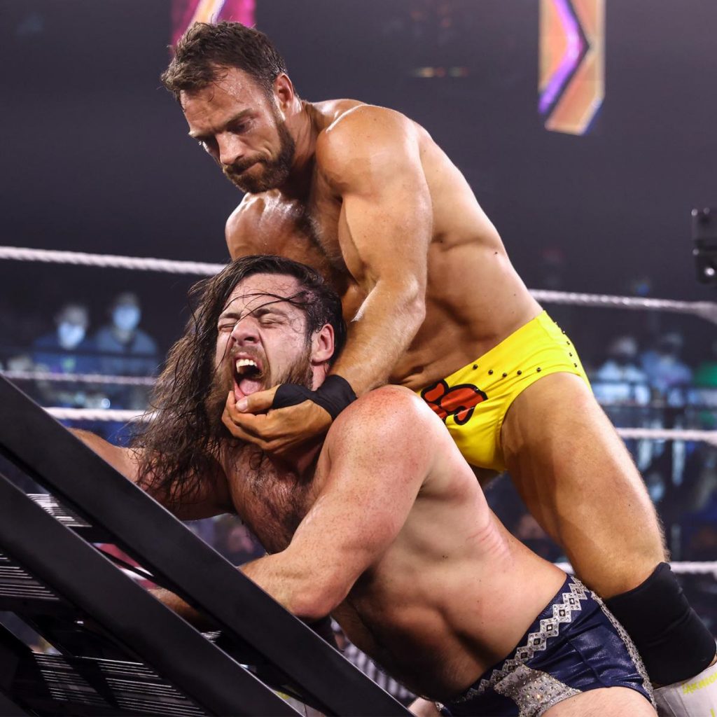 LA Knight with Cameron Grimes against a ladder