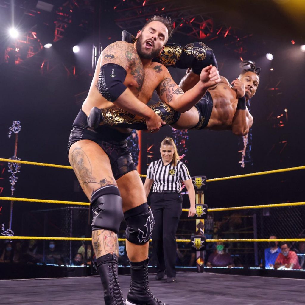 Carmello Hayes dropkicks Josh Briggs