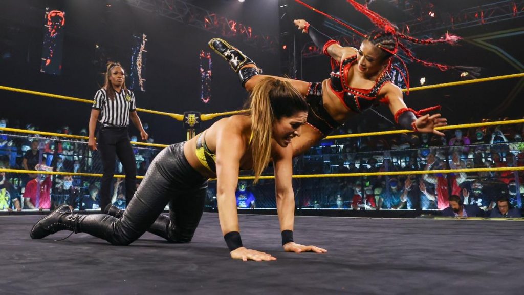 Xia Li kicks Raquel Gonzalez in the back