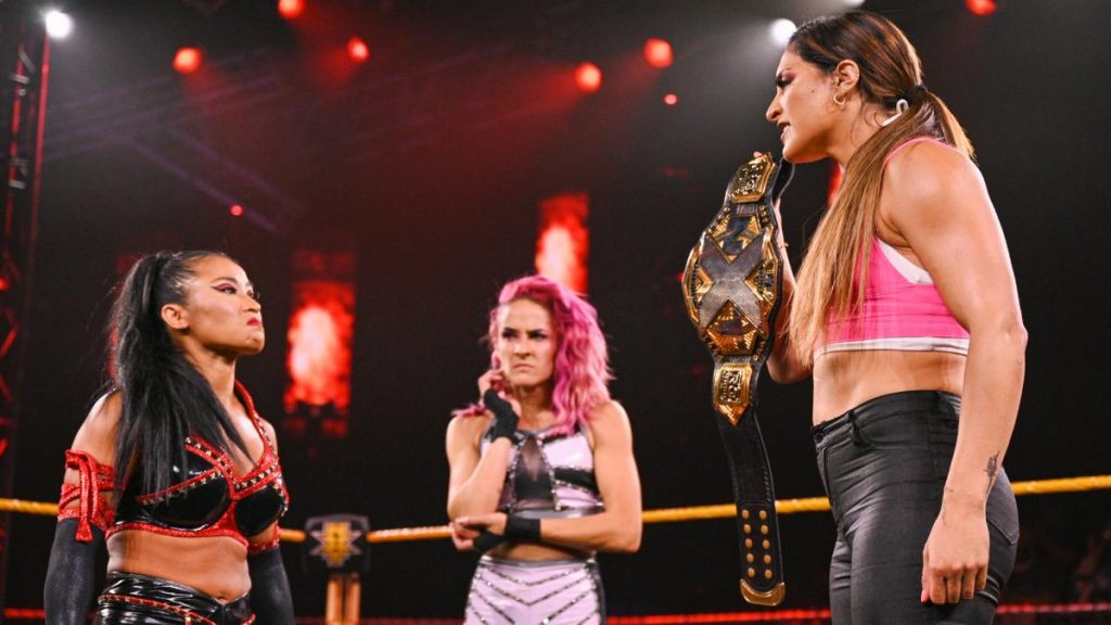 Xia Li challenges Raquel Gonzalez as Dakota Kai looks on