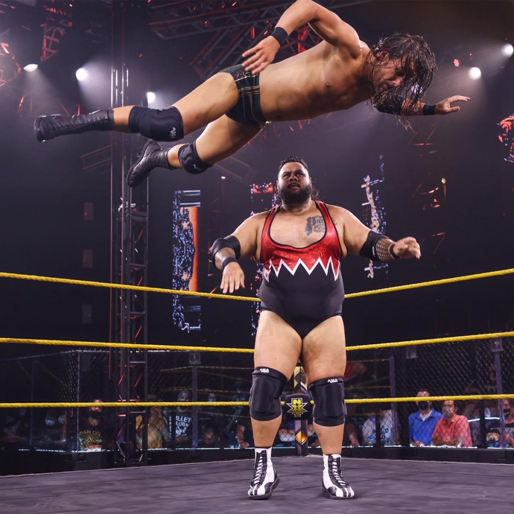 Adam Cole takes a Bronson Reed assisted flight