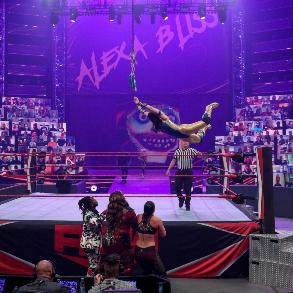 Nikki Cross flies onto Shayna Baszler, Nia Jax, and Reginald as Alexa Bliss makes her entrance