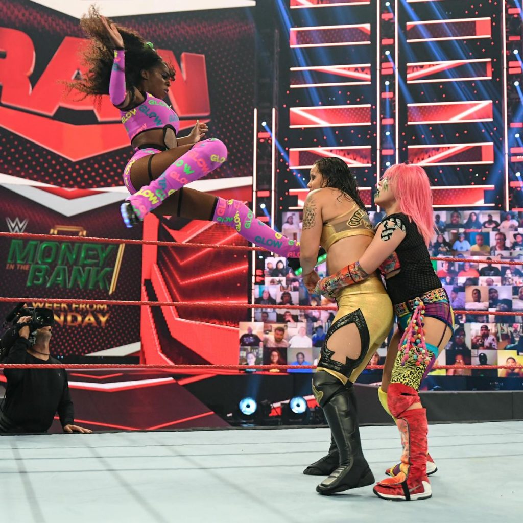 Naomi flies onto Shayna Baszler held by Asuka