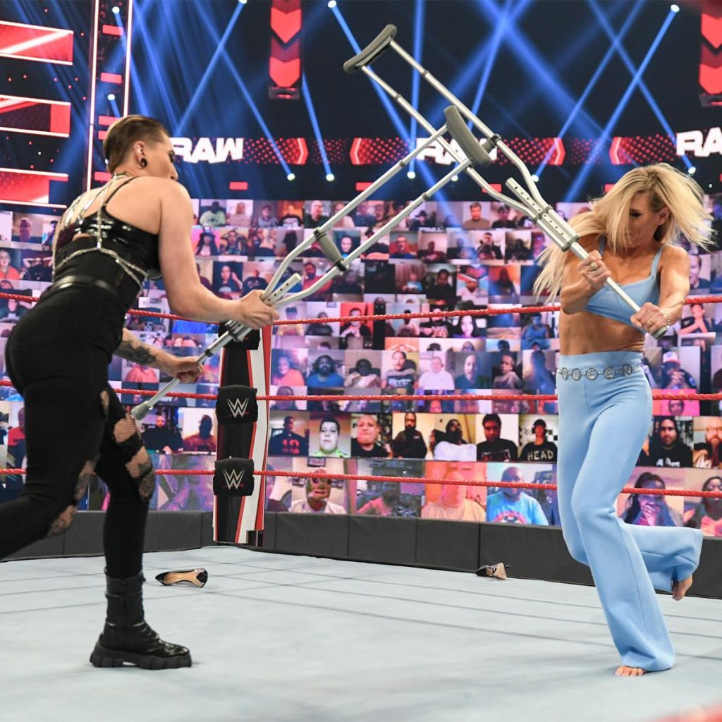 Rhea Ripley and Charlotte Flair have a crutch fight