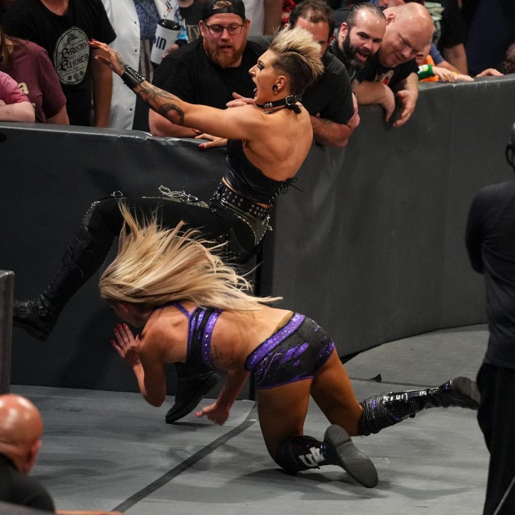 Charlotte Flair chop blocks Rhea Ripley