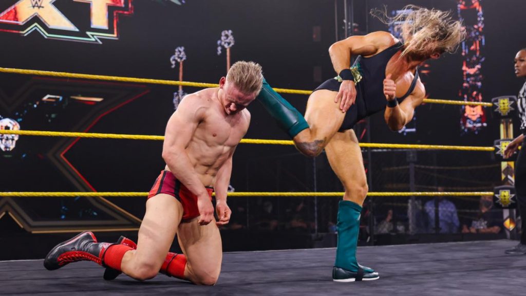 Pete Dunne kicks Ilja Dragunov in the head