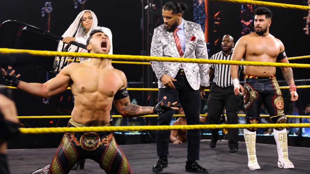 B-Fab sneak up behind Legado del Fantasma and hits Joaquin Wilde with a chair