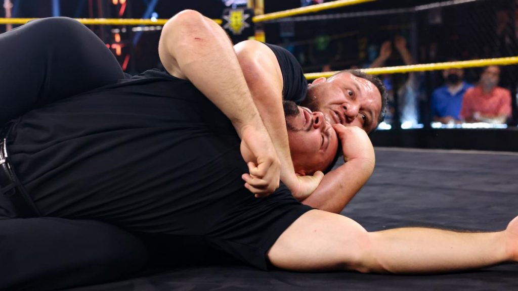 Samoa Joe puts a security guard to sleep in the Coquina Clutch