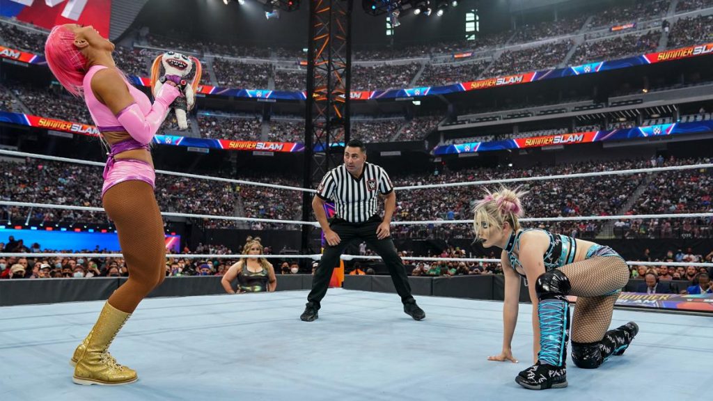 Eva Marie waves Lilly at Alexa Bliss